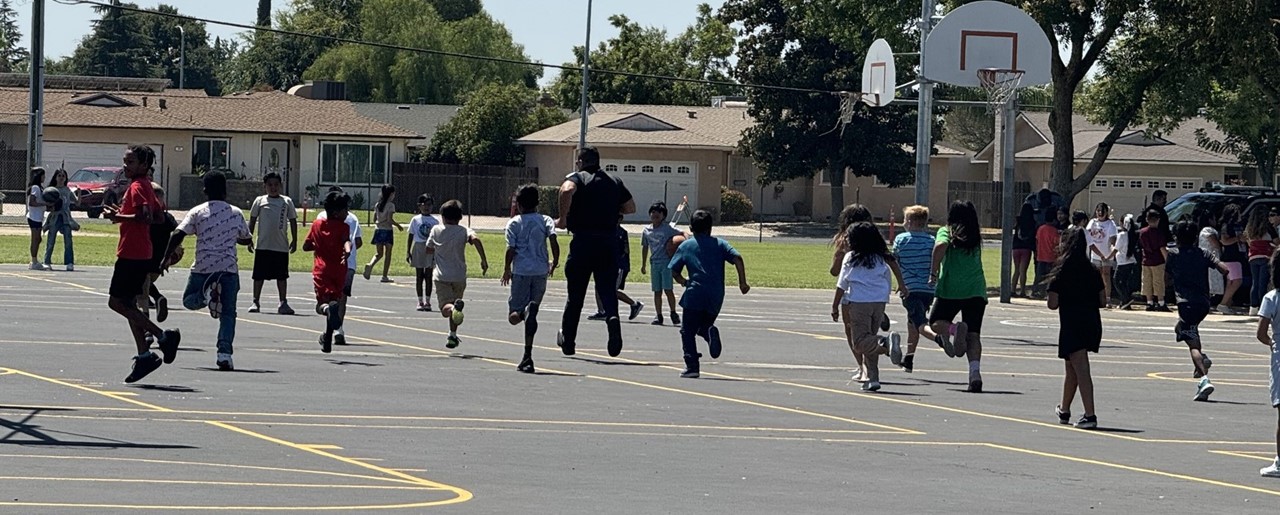 students racing police officer